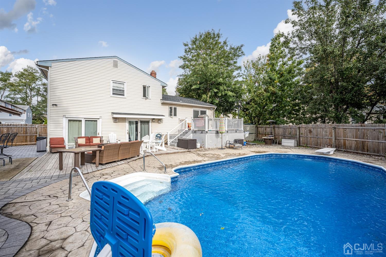 20 Outcalt Road Edison, NJ 08817 - Photo 9 of 35 a view of a house with swimming pool and sitting area
