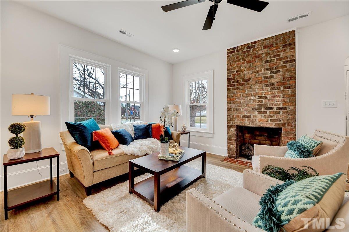 602 West Main Street Benson, NC 27504 - Photo 12 of 42 a living room with furniture and a fireplace