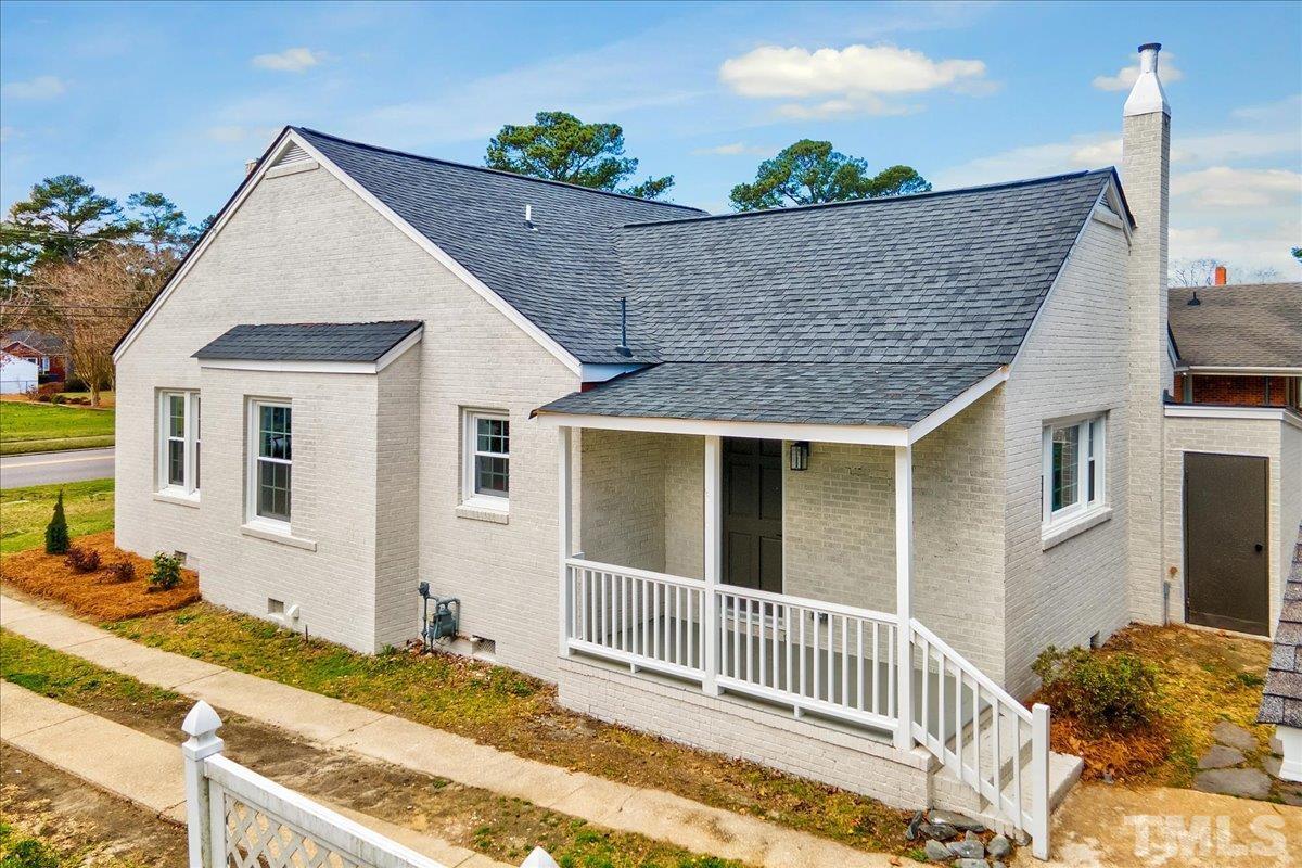 602 West Main Street Benson, NC 27504 - Photo 28 of 42 a view of house with backyard and sitting area