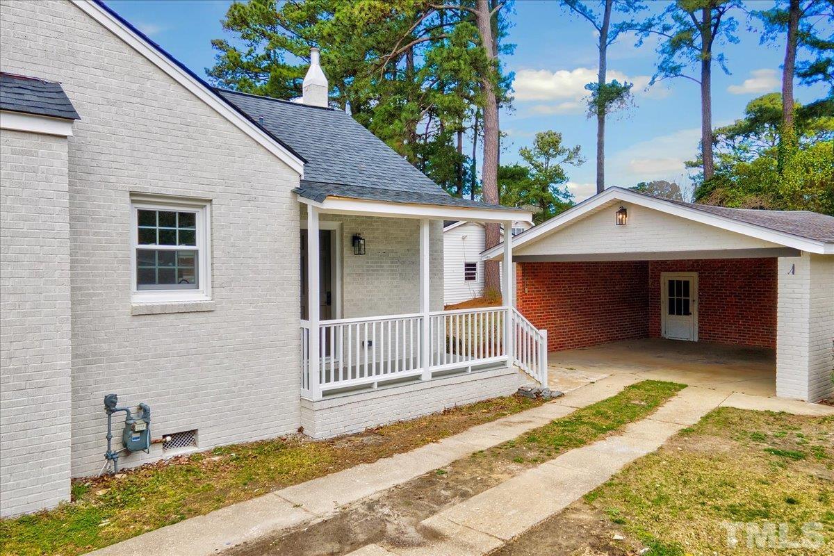 602 West Main Street Benson, NC 27504 - Photo 29 of 42 a house with trees in the background