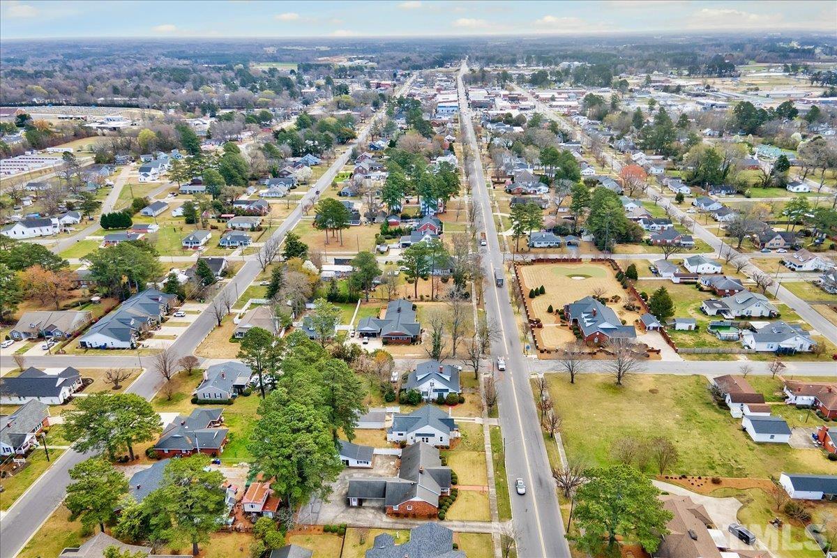 602 West Main Street Benson, NC 27504 - Photo 35 of 42 an aerial view of residential houses with outdoor space