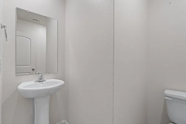 a kitchen with stainless steel appliances granite countertop a stove and a refrigerator
