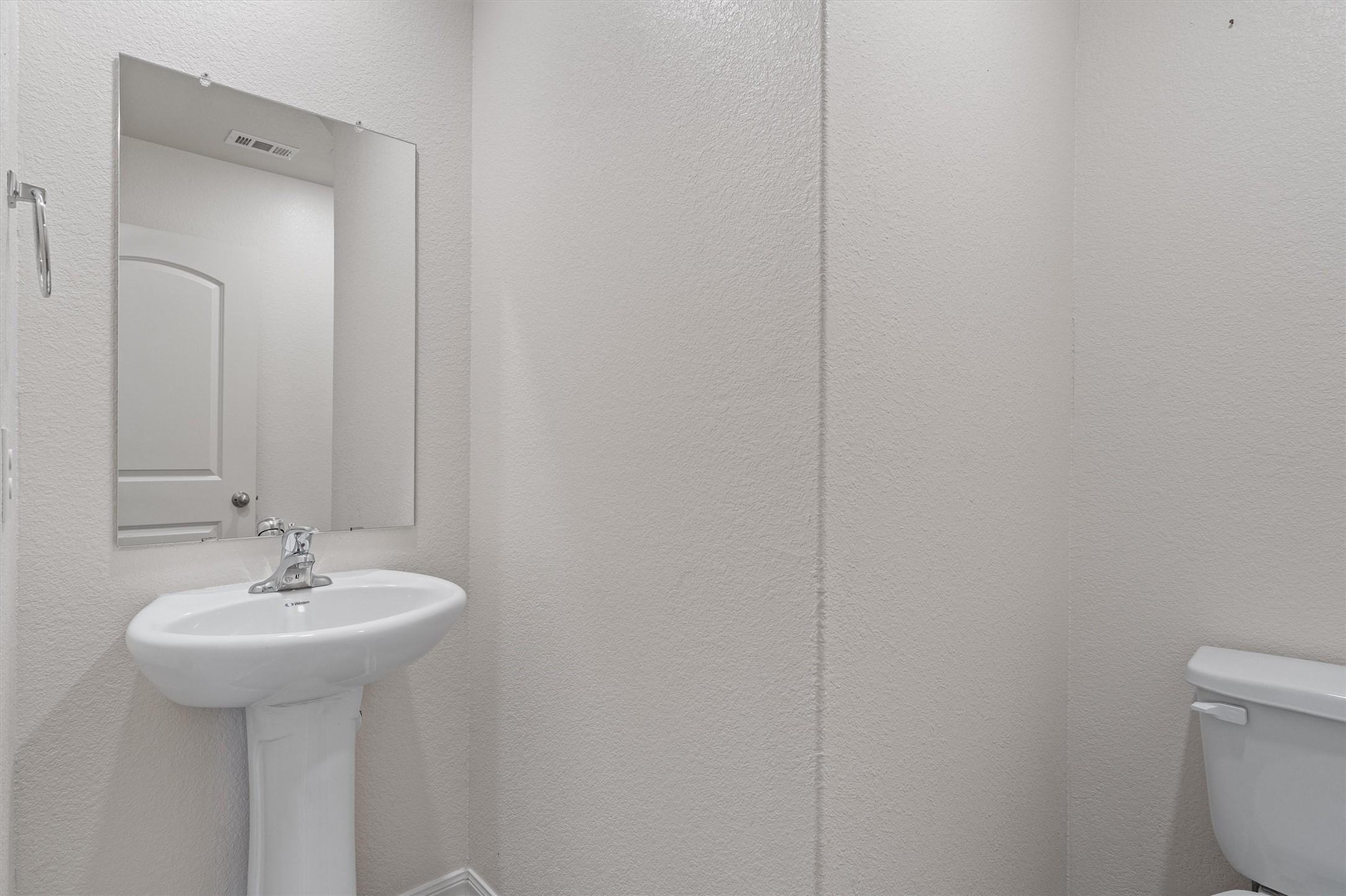 163 Niven Path, Unit 12K Jarrell, TX 76537 - Photo 14 of 39 Half bathroom on the main floor