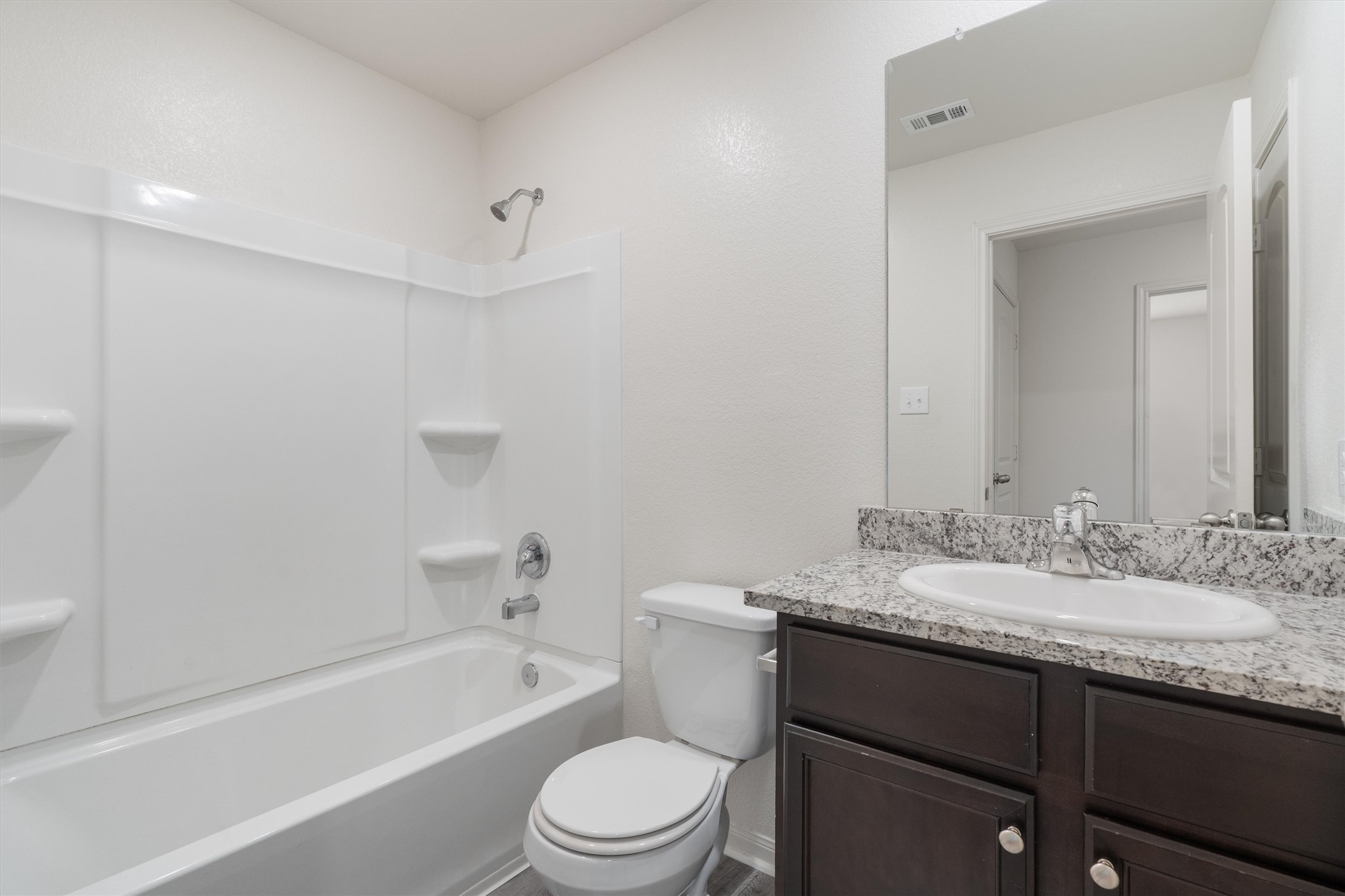 163 Niven Path, Unit 12K Jarrell, TX 76537 - Photo 23 of 39 Bathroom with vanity and shower / tub combination.