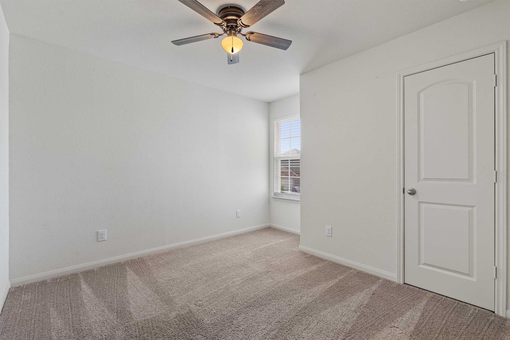 163 Niven Path, Unit 12K Jarrell, TX 76537 - Photo 28 of 39 Secondary Bedroom with a good sized closet and lots of natural lighting.