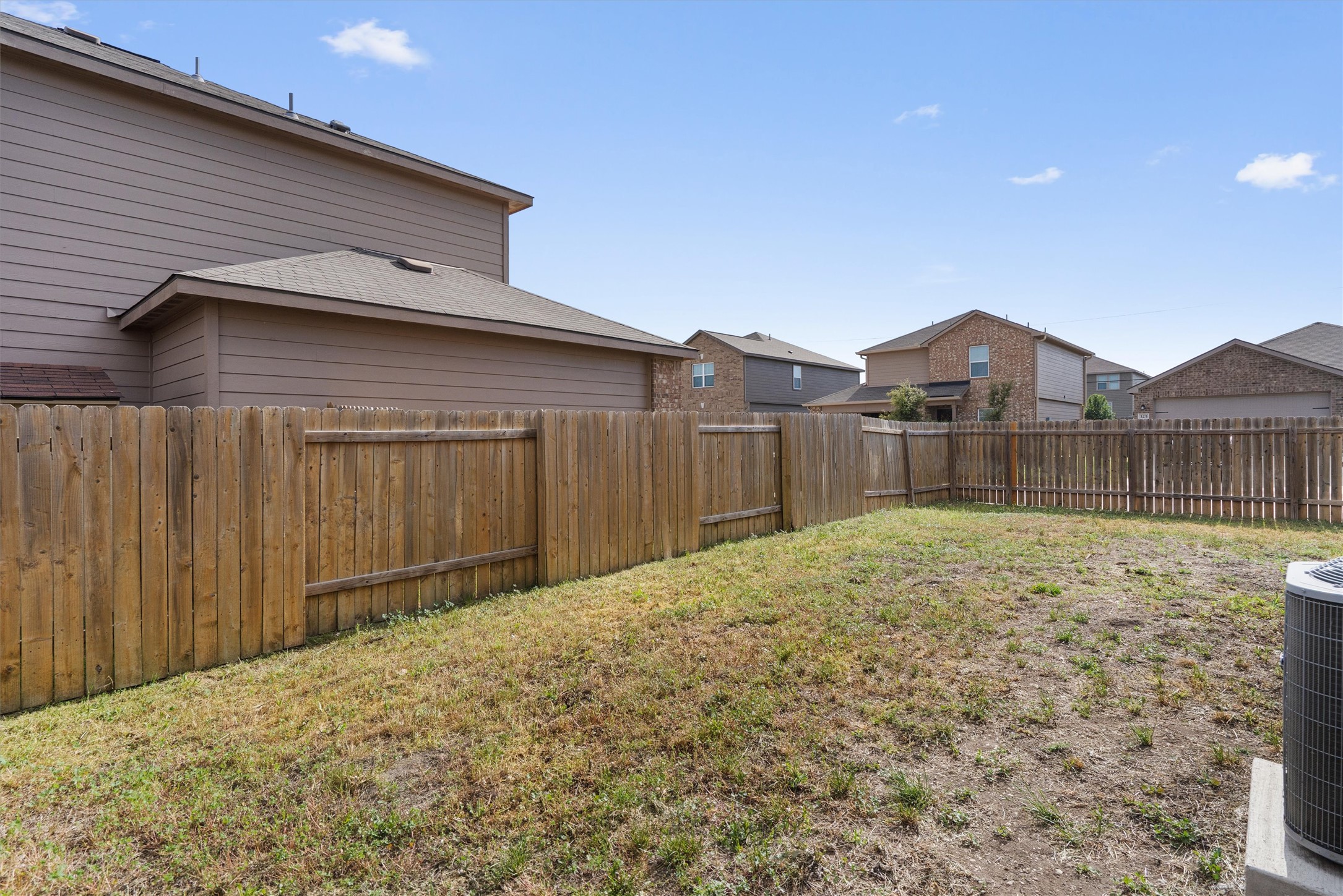 163 Niven Path, Unit 12K Jarrell, TX 76537 - Photo 30 of 39 Fenced backyard.