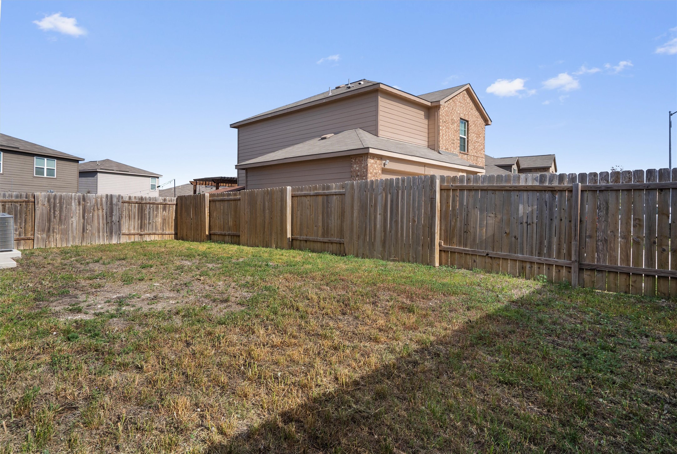 163 Niven Path, Unit 12K Jarrell, TX 76537 - Photo 34 of 39 View of fully fenced back yard. Large Corner lot.