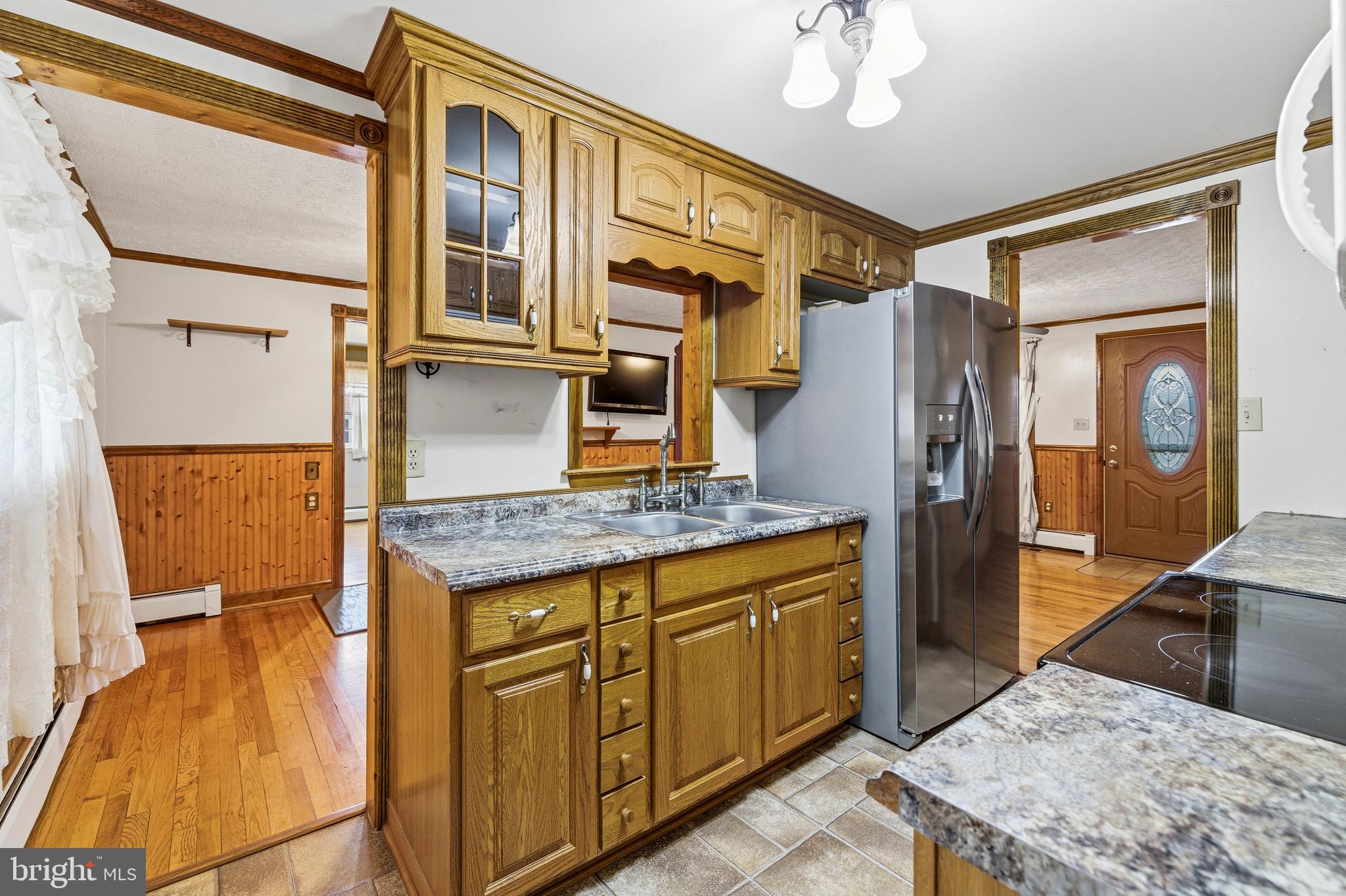 5009 Mill Creek Road Luray, VA 22835 - Photo 16 of 87 a bathroom with a granite countertop sink a mirror and shower