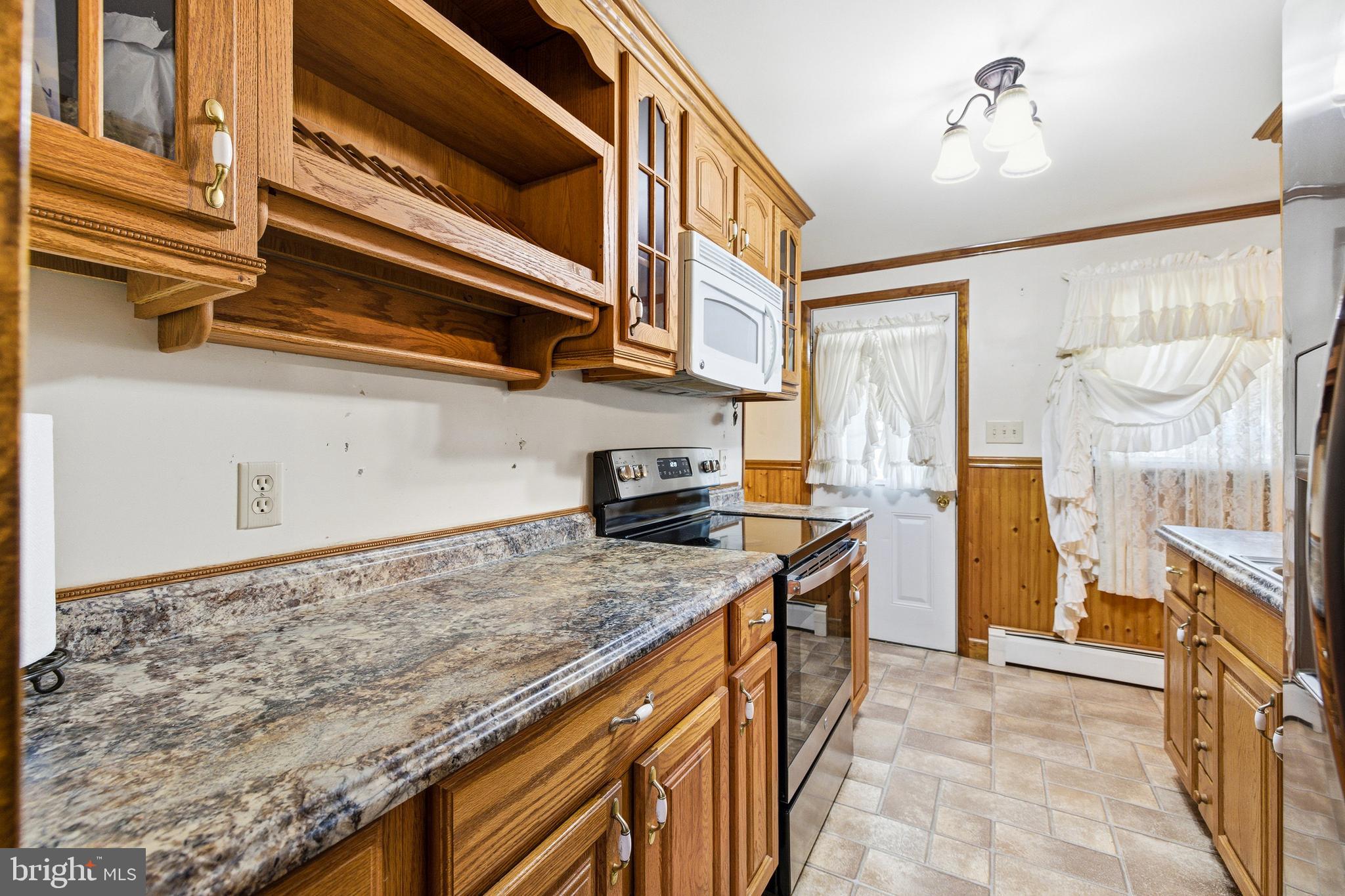5009 Mill Creek Road Luray, VA 22835 - Photo 17 of 87 a kitchen with stainless steel appliances granite countertop a sink and a refrigerator