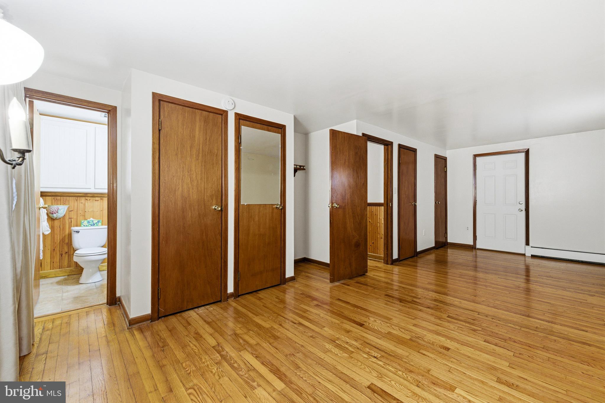 5009 Mill Creek Road Luray, VA 22835 - Photo 20 of 87 a view of an empty room with glass door and wooden floor