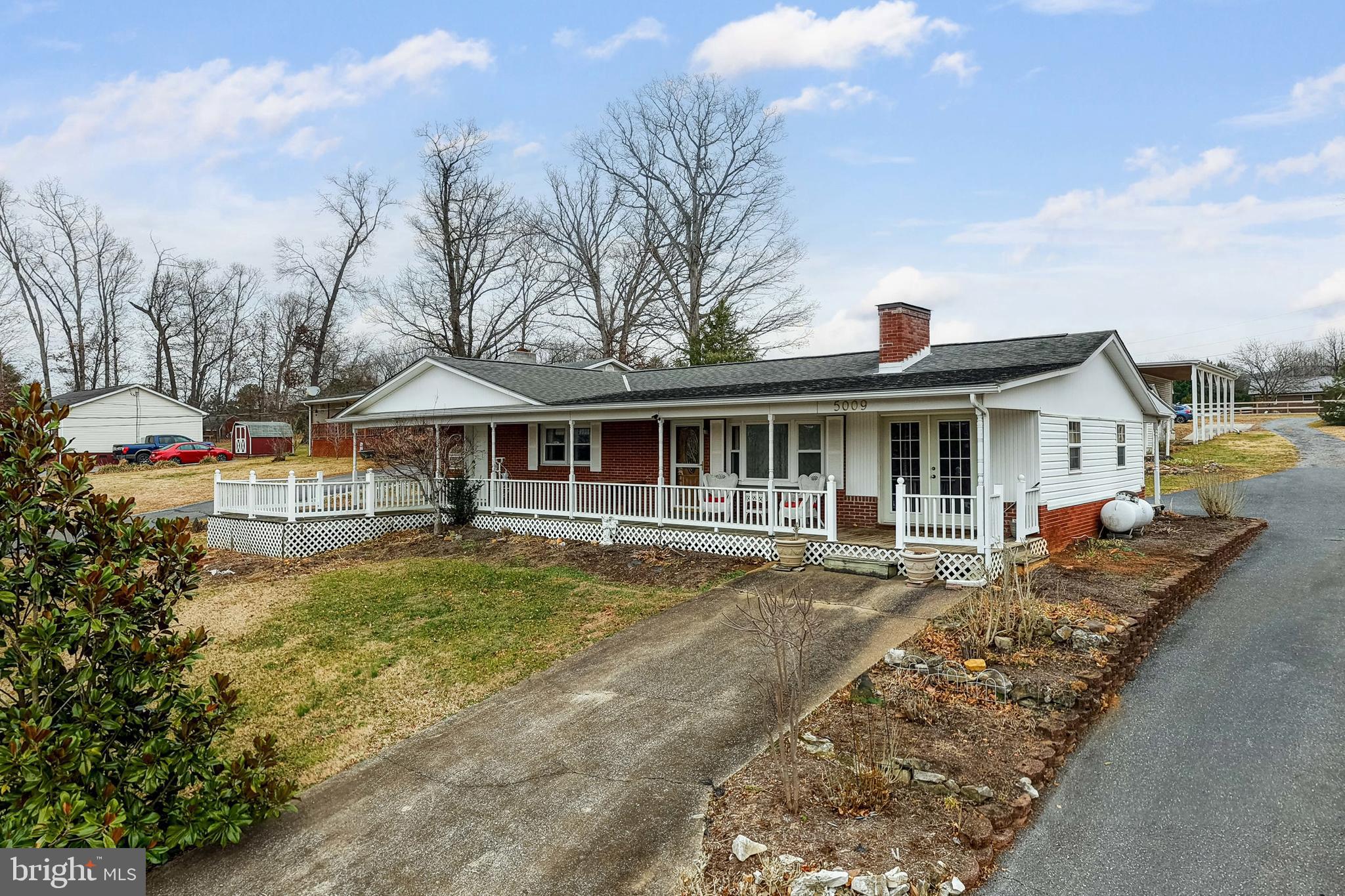 5009 Mill Creek Road Luray, VA 22835 - Photo 2 of 87 a front view of a house with swimming pool having outdoor seating