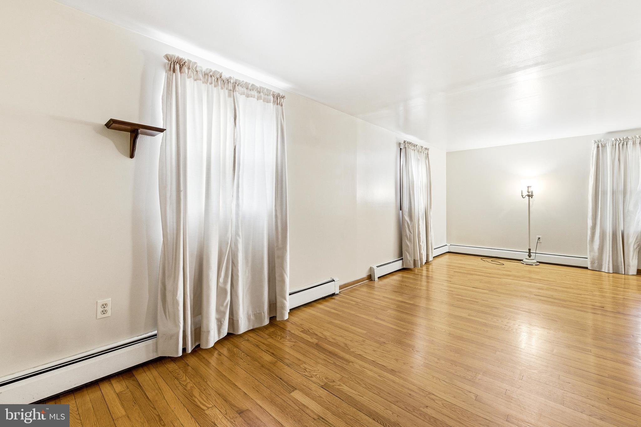 5009 Mill Creek Road Luray, VA 22835 - Photo 21 of 87 an empty room with wooden floor door and windows