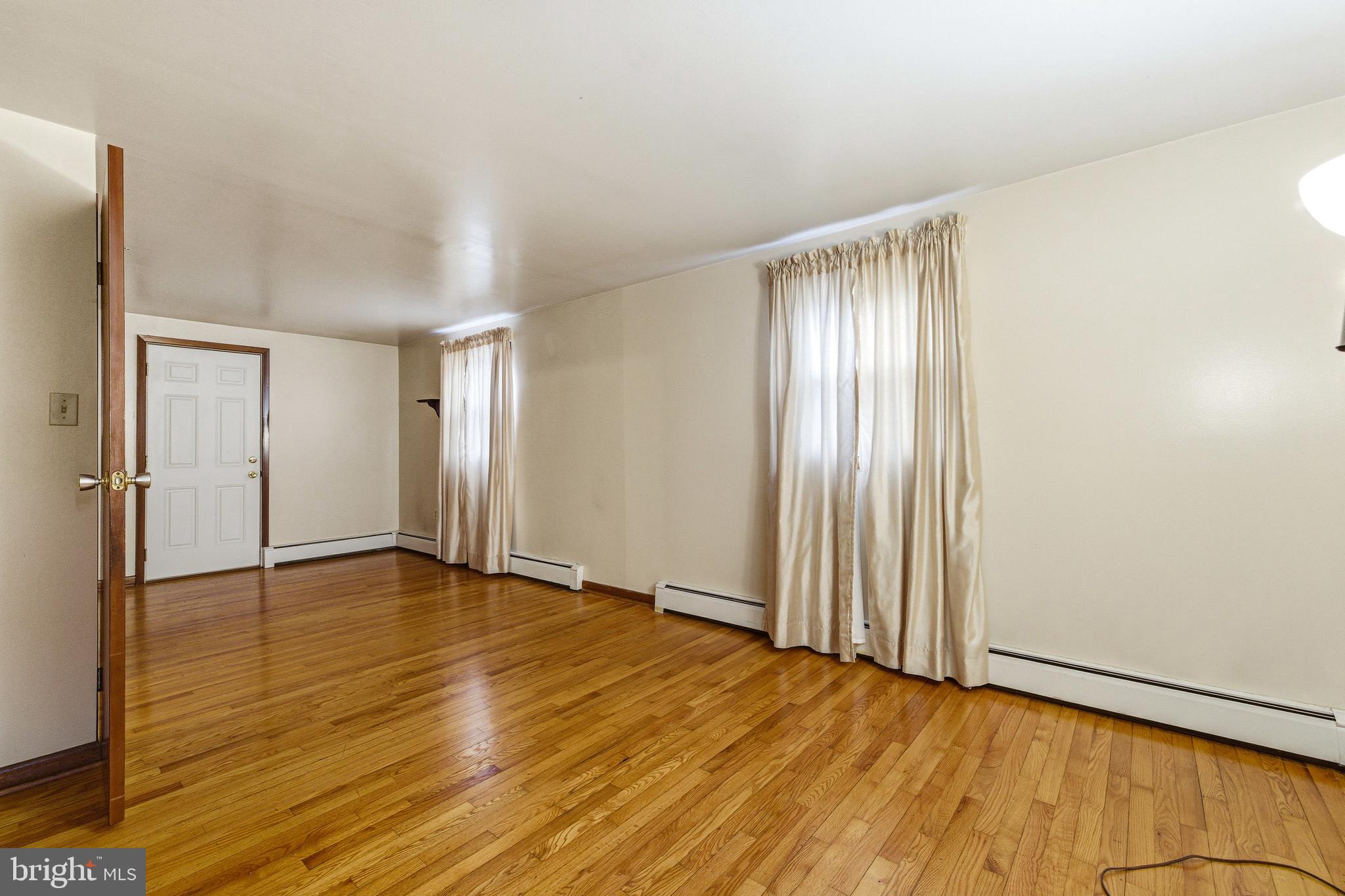 5009 Mill Creek Road Luray, VA 22835 - Photo 22 of 87 a view of an empty room with wooden floor