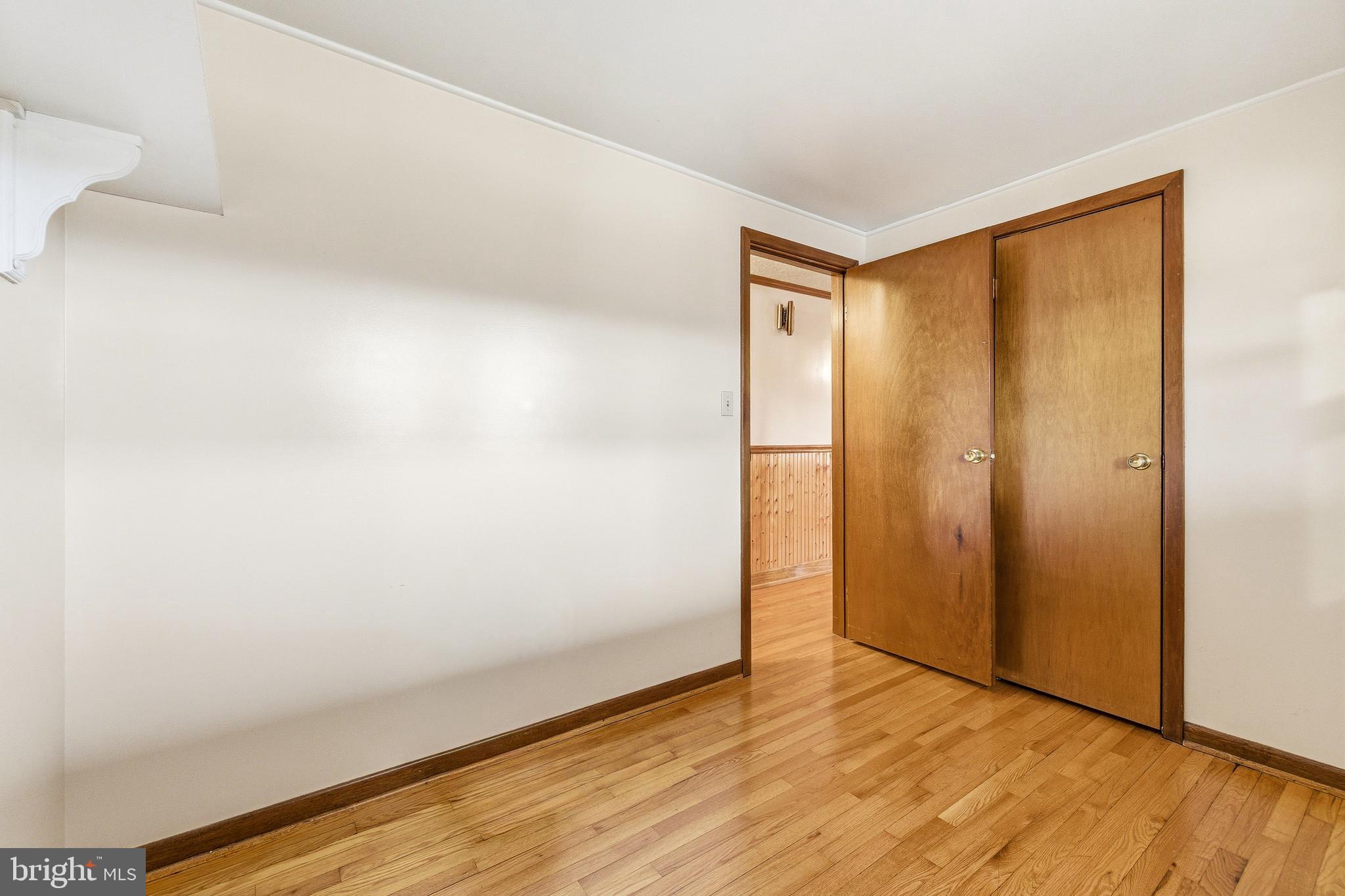 5009 Mill Creek Road Luray, VA 22835 - Photo 25 of 87 a view of an empty room with wooden floor and a window