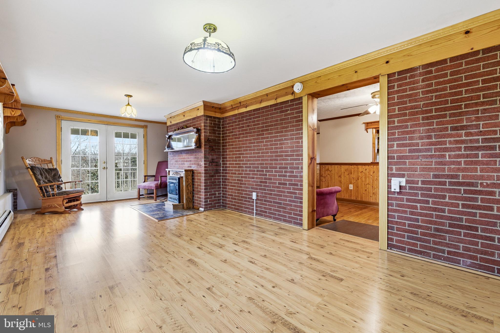 5009 Mill Creek Road Luray, VA 22835 - Photo 3 of 87 a view of a livingroom with furniture and a fireplace