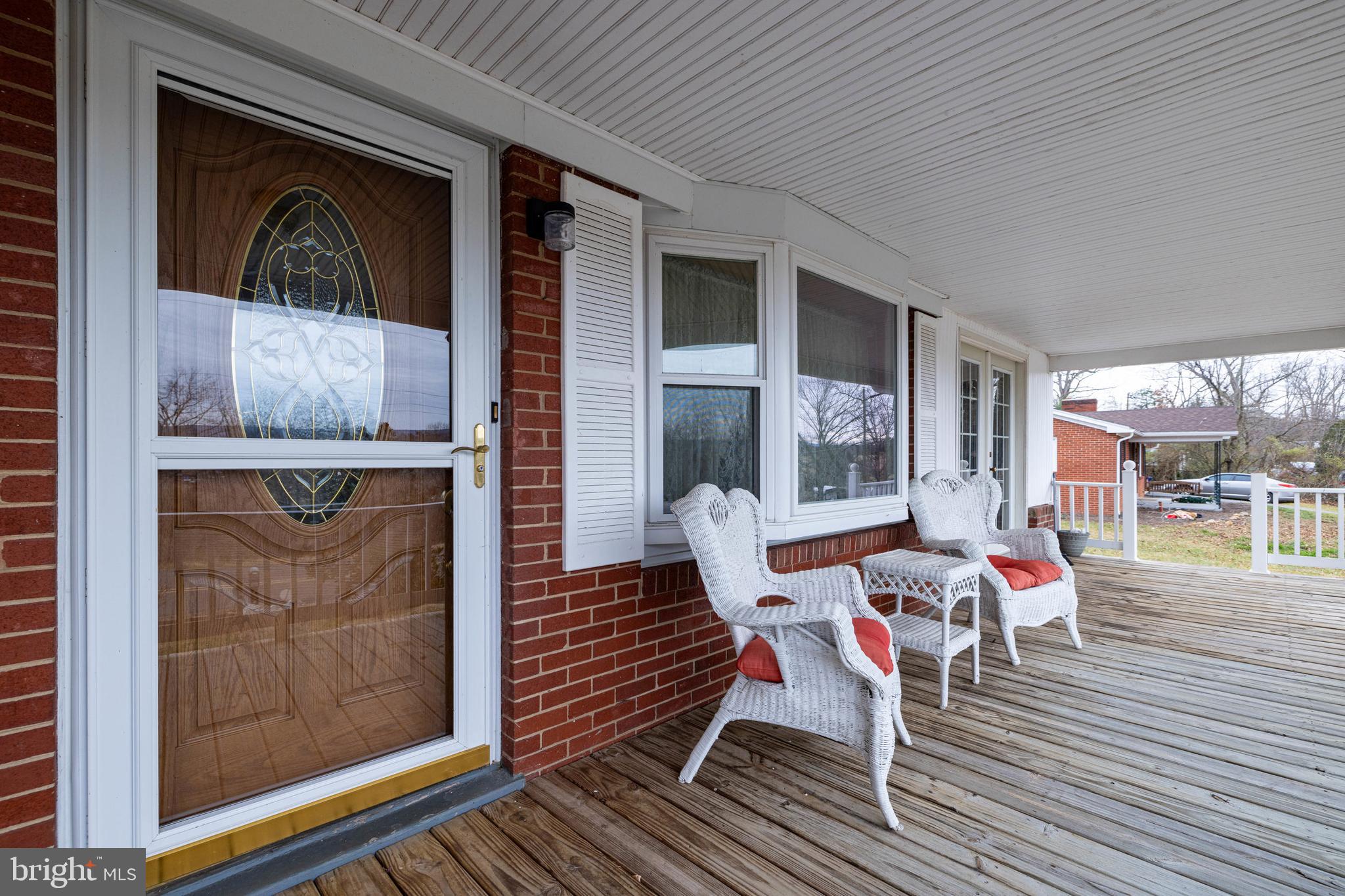 5009 Mill Creek Road Luray, VA 22835 - Photo 35 of 87 a outdoor space with patio the couches and a dining table with wooden floor