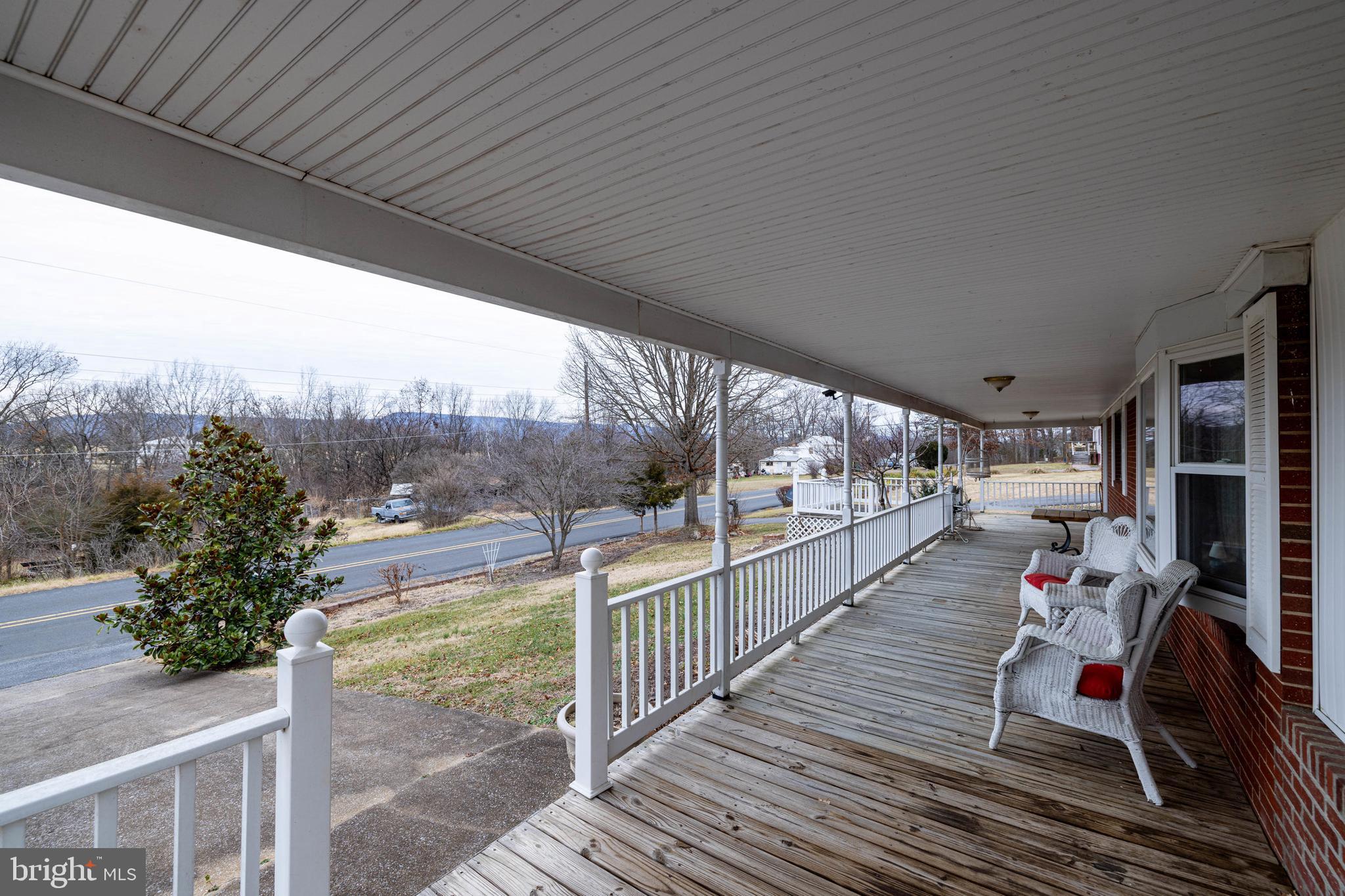 5009 Mill Creek Road Luray, VA 22835 - Photo 37 of 87 a view of a porch with furniture and a yard