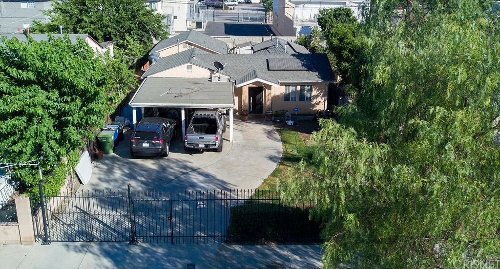13666 Pinney Street Pacoima, CA 91331 - Photo 2 of 34 an aerial view of a house with a garden