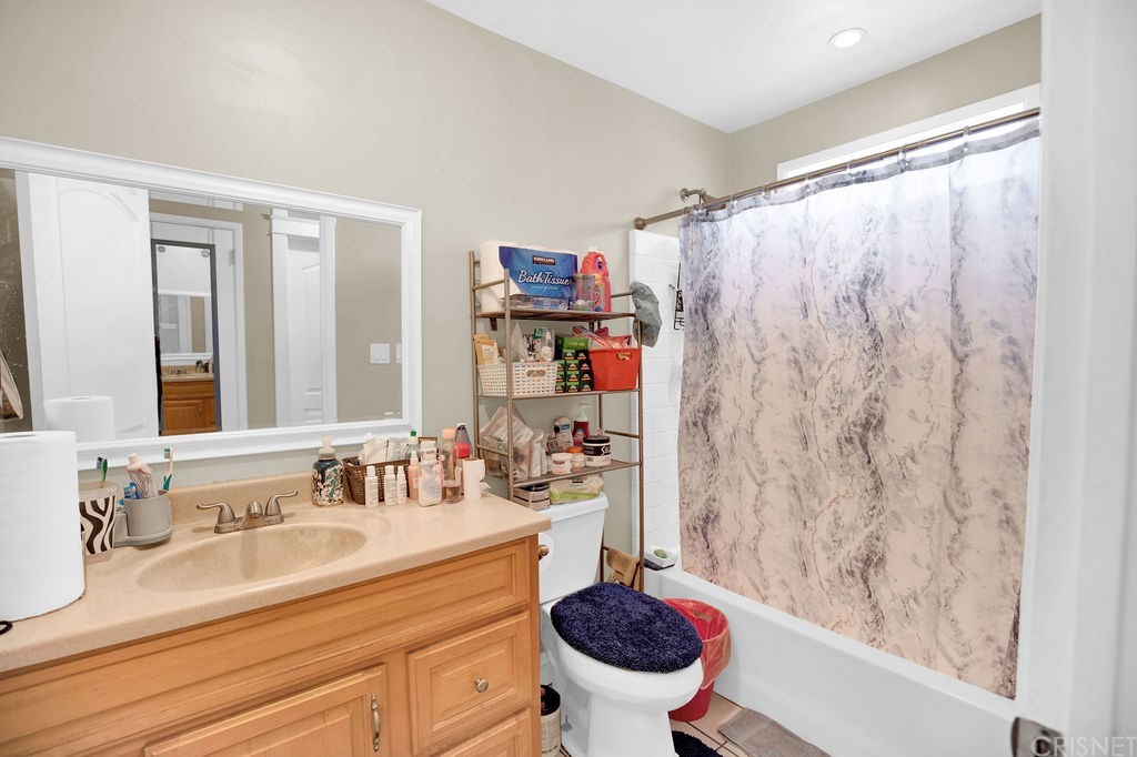 13666 Pinney Street Pacoima, CA 91331 - Photo 11 of 34 a bathroom with a sink and a mirror