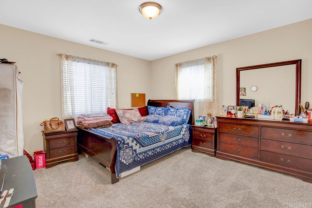 13666 Pinney Street Pacoima, CA 91331 - Photo 15 of 34 a bedroom with bed and window