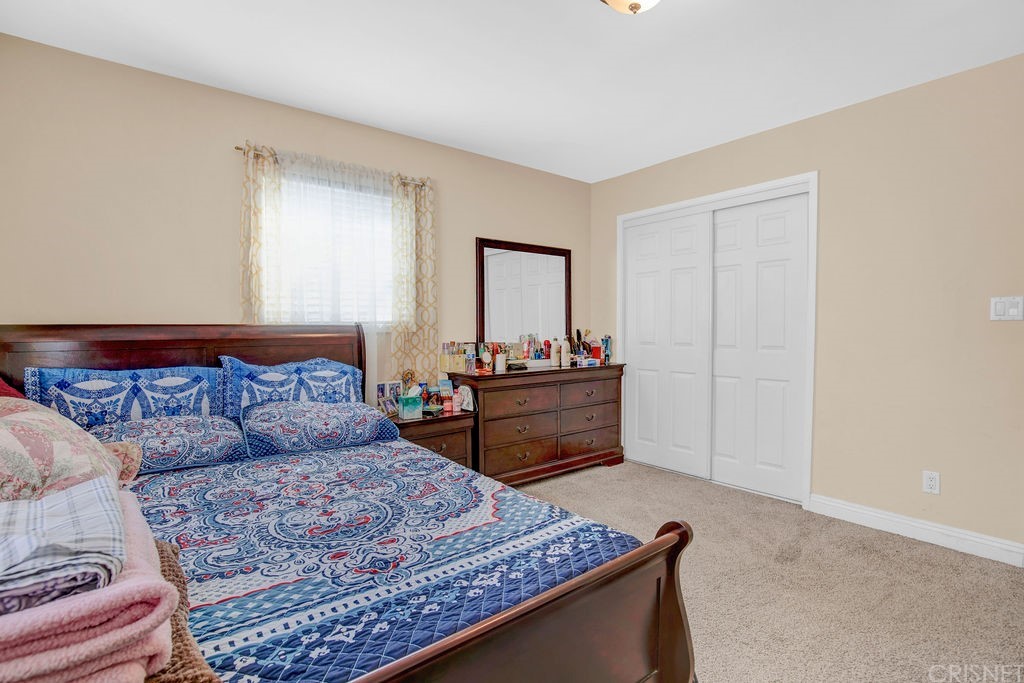 13666 Pinney Street Pacoima, CA 91331 - Photo 18 of 34 a living room with furniture and a dresser