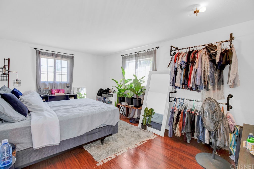 13666 Pinney Street Pacoima, CA 91331 - Photo 23 of 34 a bedroom with a bed and a closet