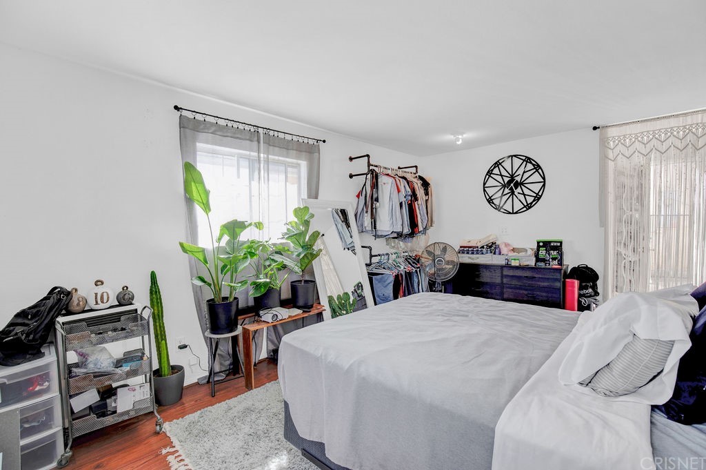 13666 Pinney Street Pacoima, CA 91331 - Photo 25 of 34 a bedroom with a bed and a chair