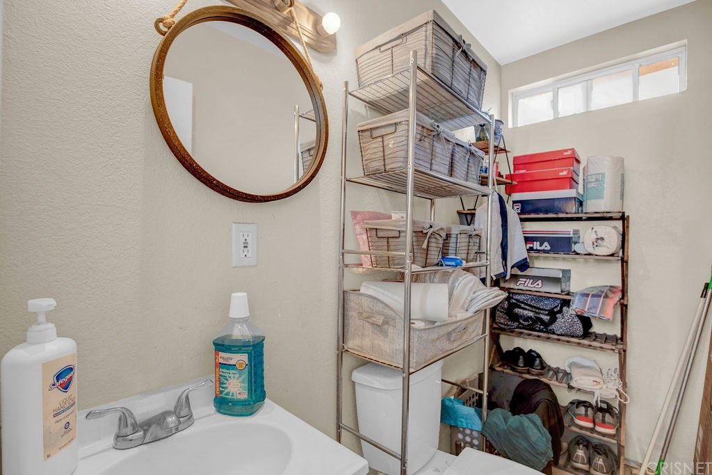13666 Pinney Street Pacoima, CA 91331 - Photo 26 of 34 a bathroom with a sink and a mirror