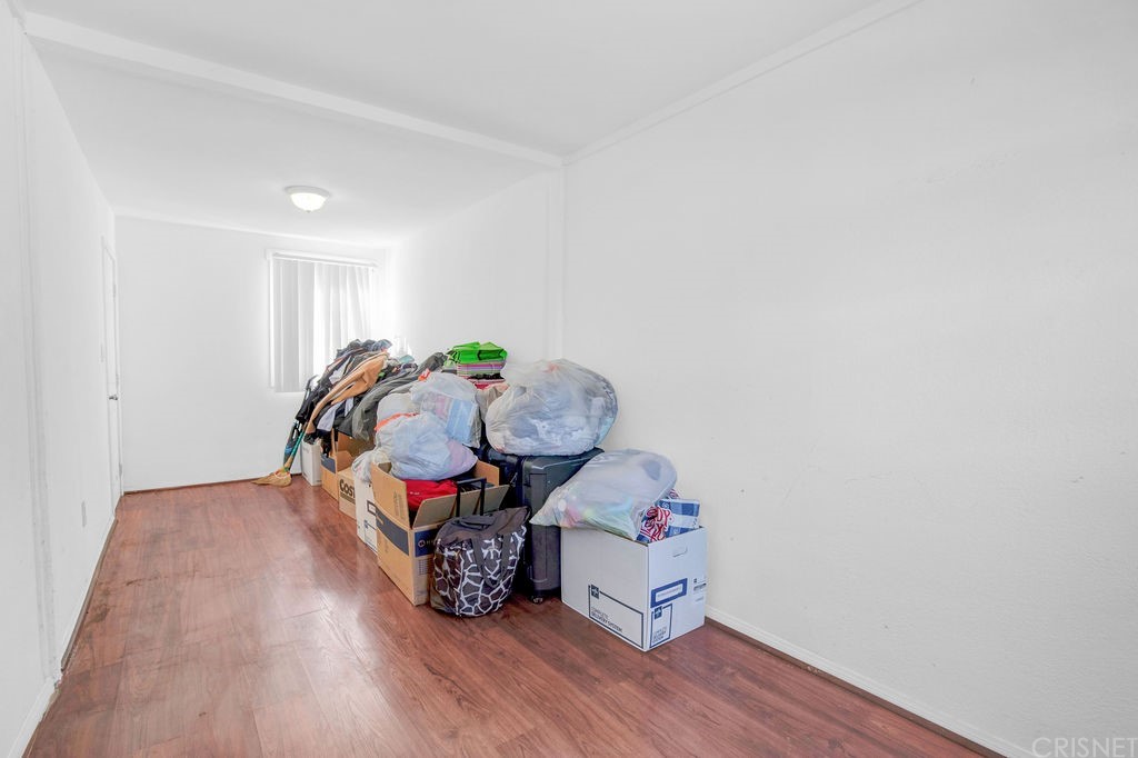 13666 Pinney Street Pacoima, CA 91331 - Photo 27 of 34 a living room with furniture and wooden floor