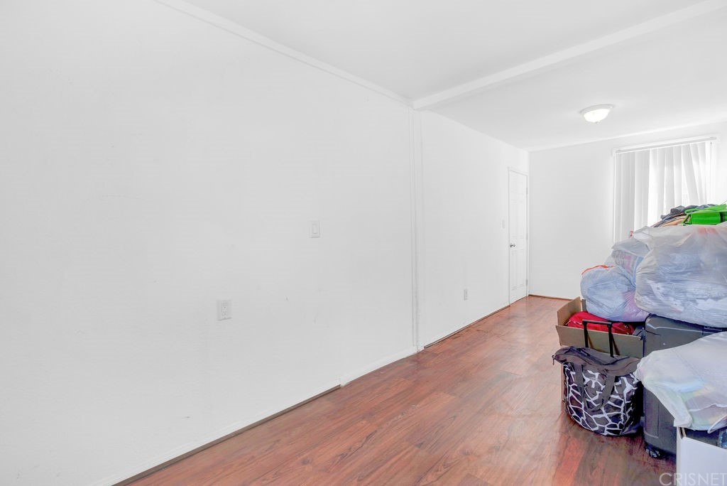 13666 Pinney Street Pacoima, CA 91331 - Photo 28 of 34 a very nice looking room with wooden floor