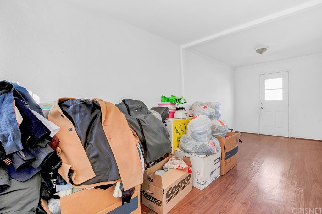 13666 Pinney Street Pacoima, CA 91331 - Photo 29 of 34 a view of walk in closet with clothes and shoes