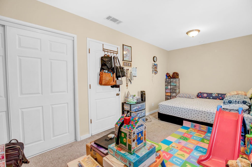 13666 Pinney Street Pacoima, CA 91331 - Photo 32 of 34 a room with furniture and a couch