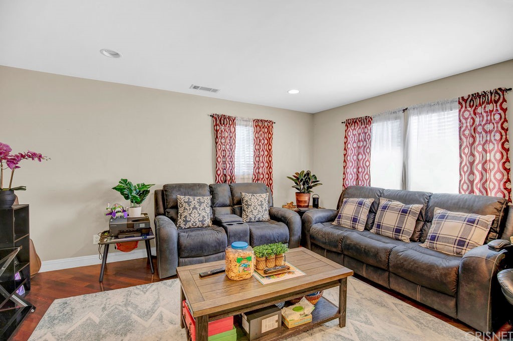 13666 Pinney Street Pacoima, CA 91331 - Photo 5 of 34 a living room with furniture and a potted plant