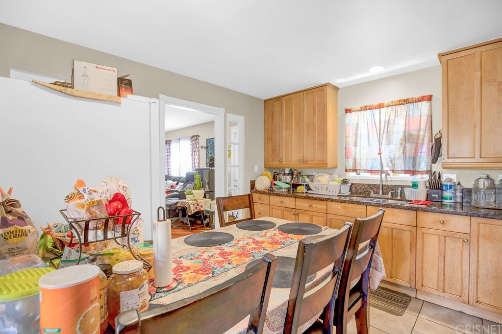13666 Pinney Street Pacoima, CA 91331 - Photo 9 of 34 a view of a kitchen and dining room