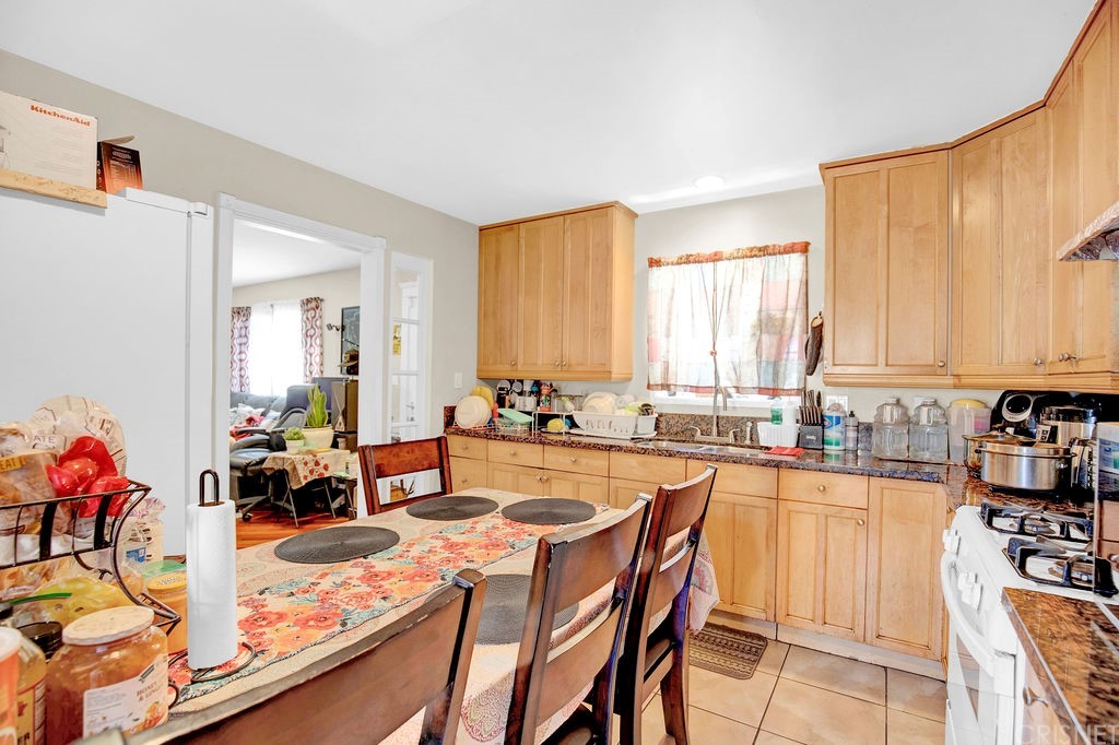 13666 Pinney Street Pacoima, CA 91331 - Photo 10 of 34 a view of a dining room with furniture and a window