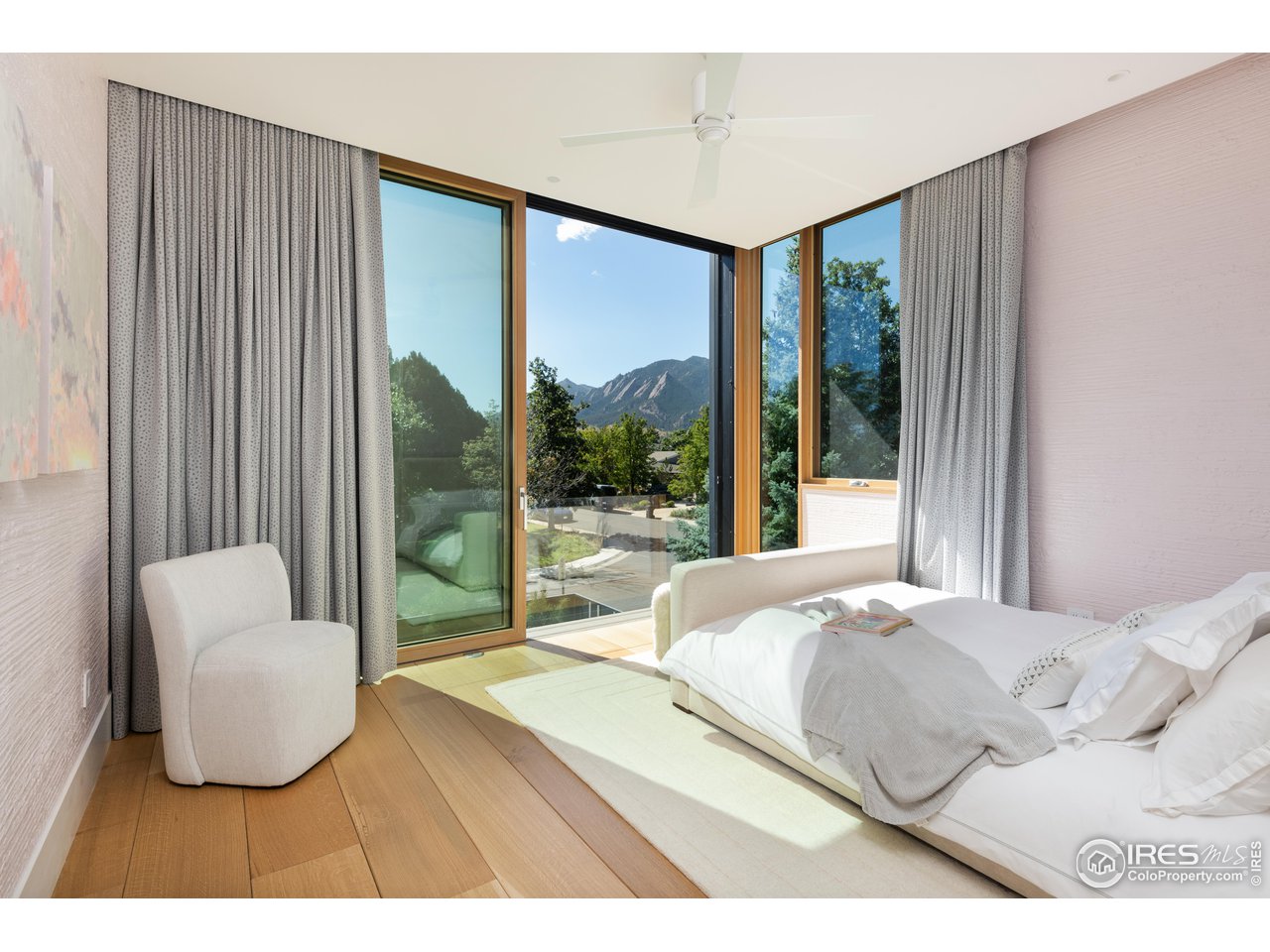 1505 Sunset Boulevard Boulder, CO 80304 - Photo 18 of 40 a bedroom with a bed and a large window