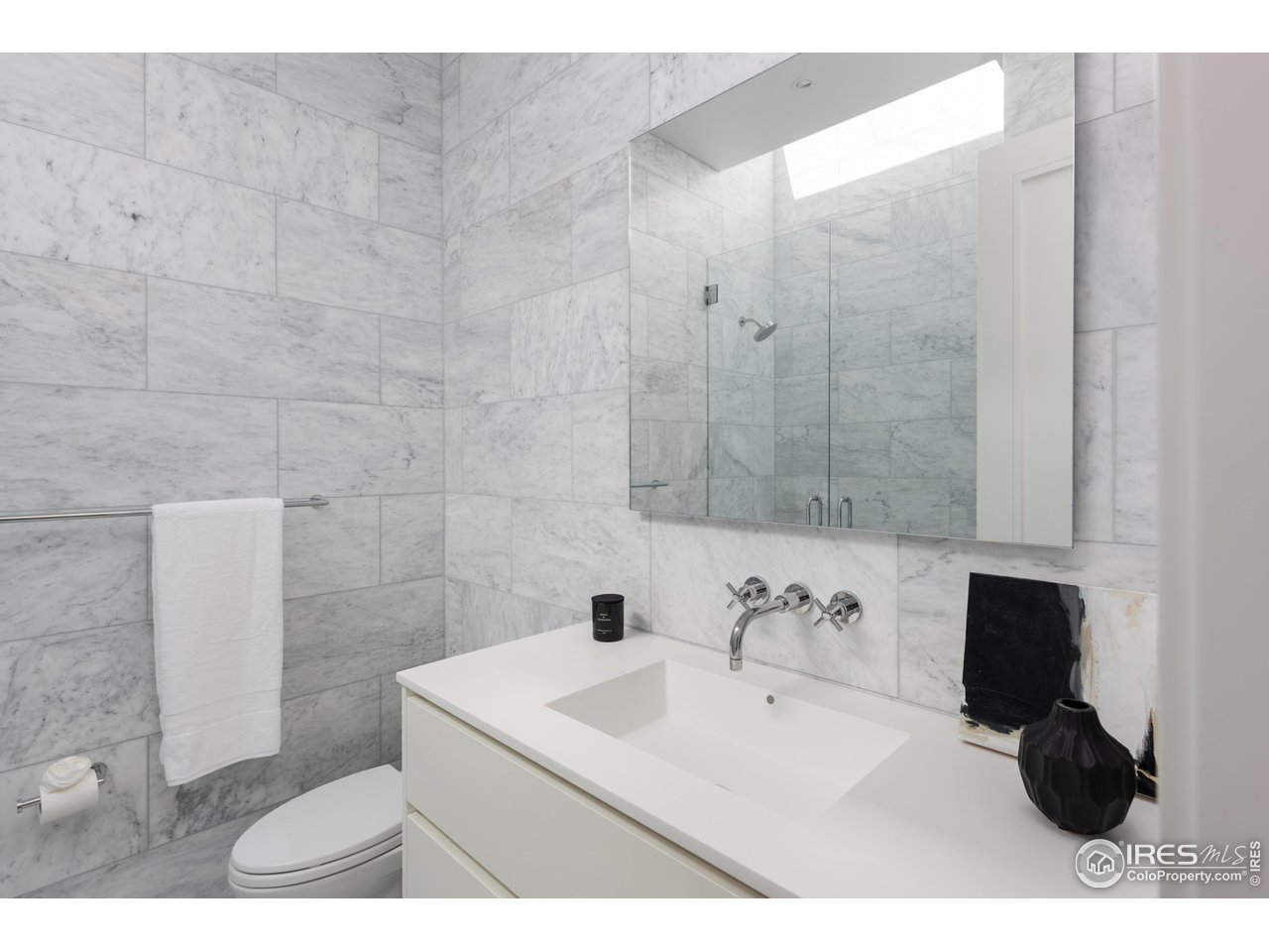 1505 Sunset Boulevard Boulder, CO 80304 - Photo 22 of 40 a bathroom with a sink and a mirror