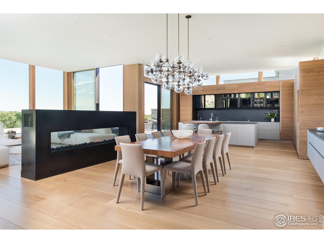 1505 Sunset Boulevard Boulder, CO 80304 - Photo 4 of 40 a dining room with furniture a chandelier and wooden floor