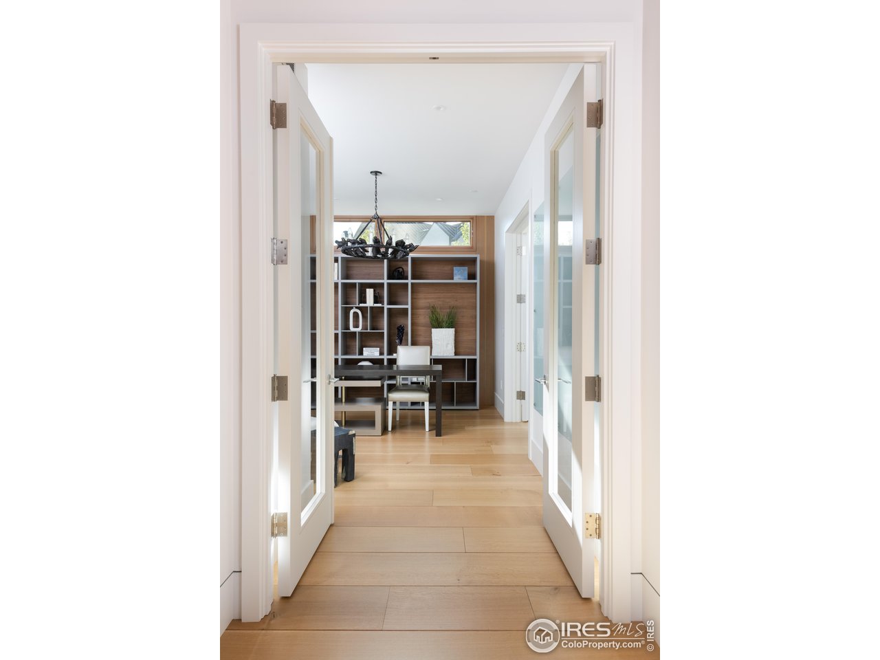 1505 Sunset Boulevard Boulder, CO 80304 - Photo 9 of 40 a view of a hallway with chairs and couches with wooden floor