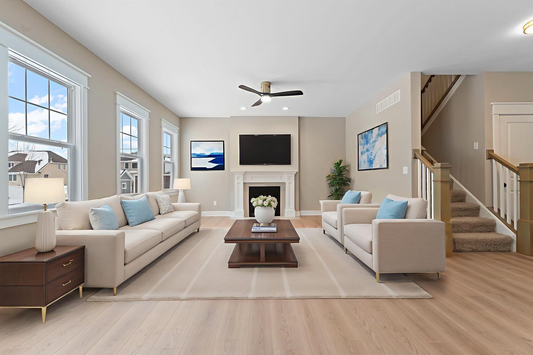 2132 Pradera Trail Chesterton, IN 46304 - Photo 11 of 46 a living room with furniture a fireplace and a flat screen tv