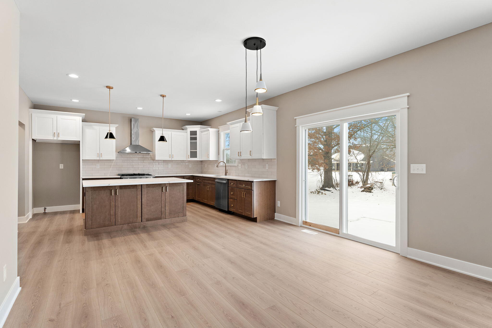 2132 Pradera Trail Chesterton, IN 46304 - Photo 14 of 45 a large kitchen with a large counter top a sink stainless steel appliances and cabinets