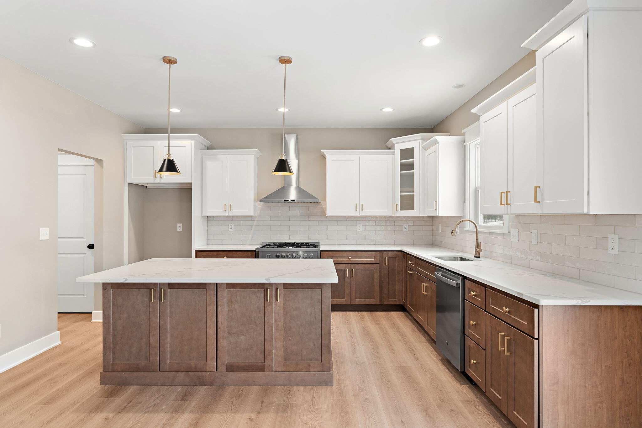2132 Pradera Trail Chesterton, IN 46304 - Photo 16 of 46 a large kitchen with stainless steel appliances kitchen island granite countertop a sink stove and cabinets