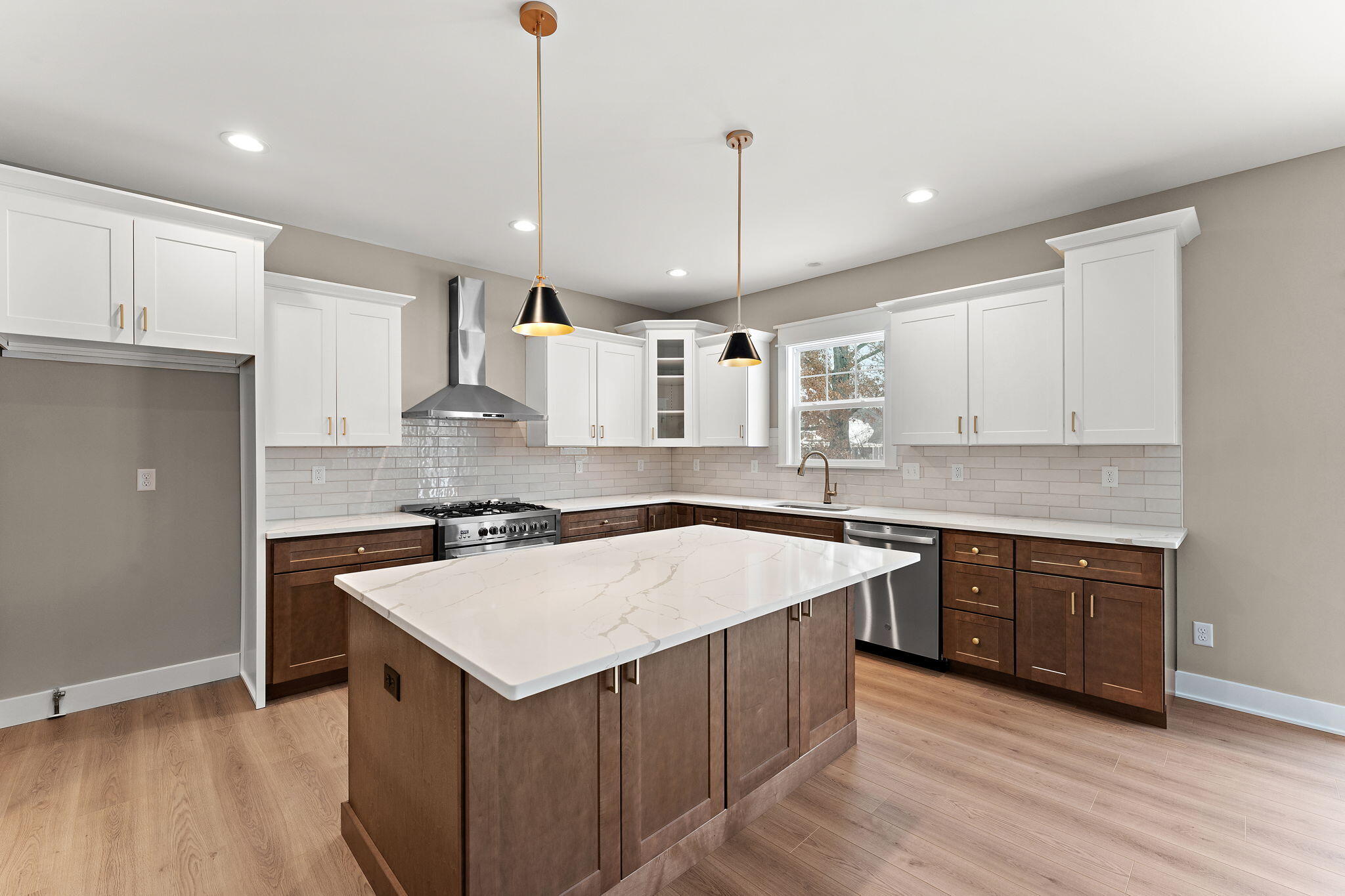 2132 Pradera Trail Chesterton, IN 46304 - Photo 18 of 46 a large kitchen with stainless steel appliances granite countertop a sink a stove a refrigerator and a oven with wooden floor