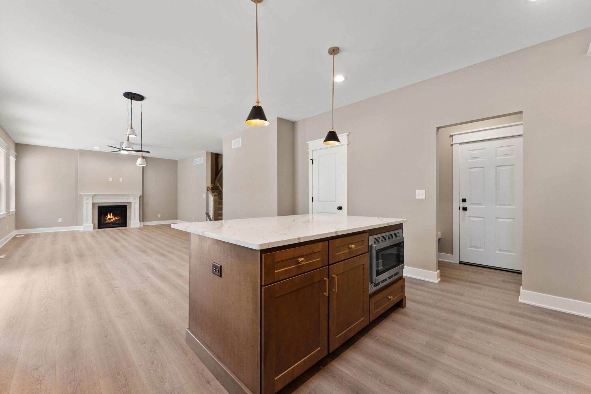 2132 Pradera Trail Chesterton, IN 46304 - Photo 20 of 45 a spacious kitchen with a sink and a wooden floor