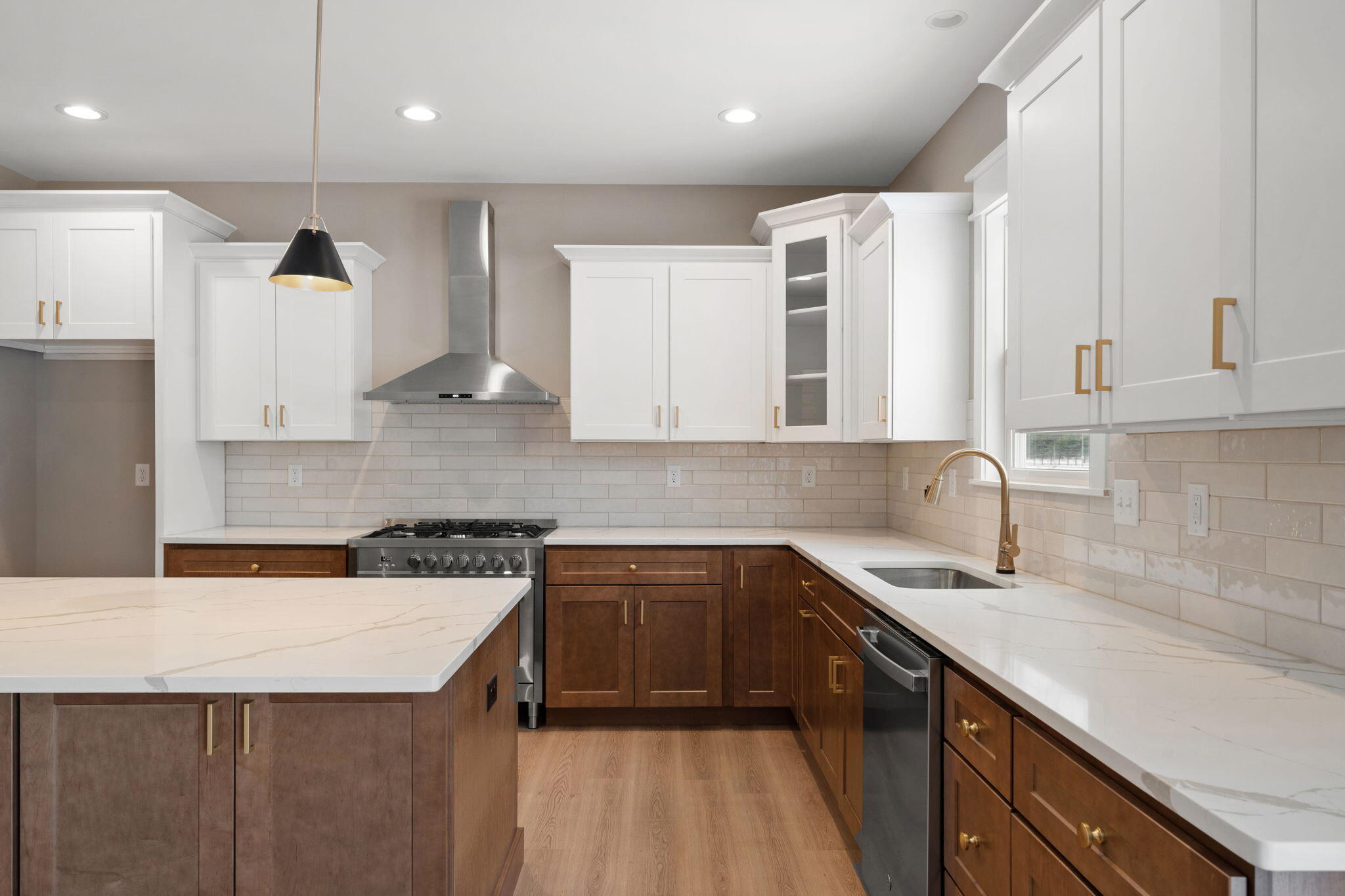 2132 Pradera Trail Chesterton, IN 46304 - Photo 22 of 45 a kitchen with a sink stove and cabinets