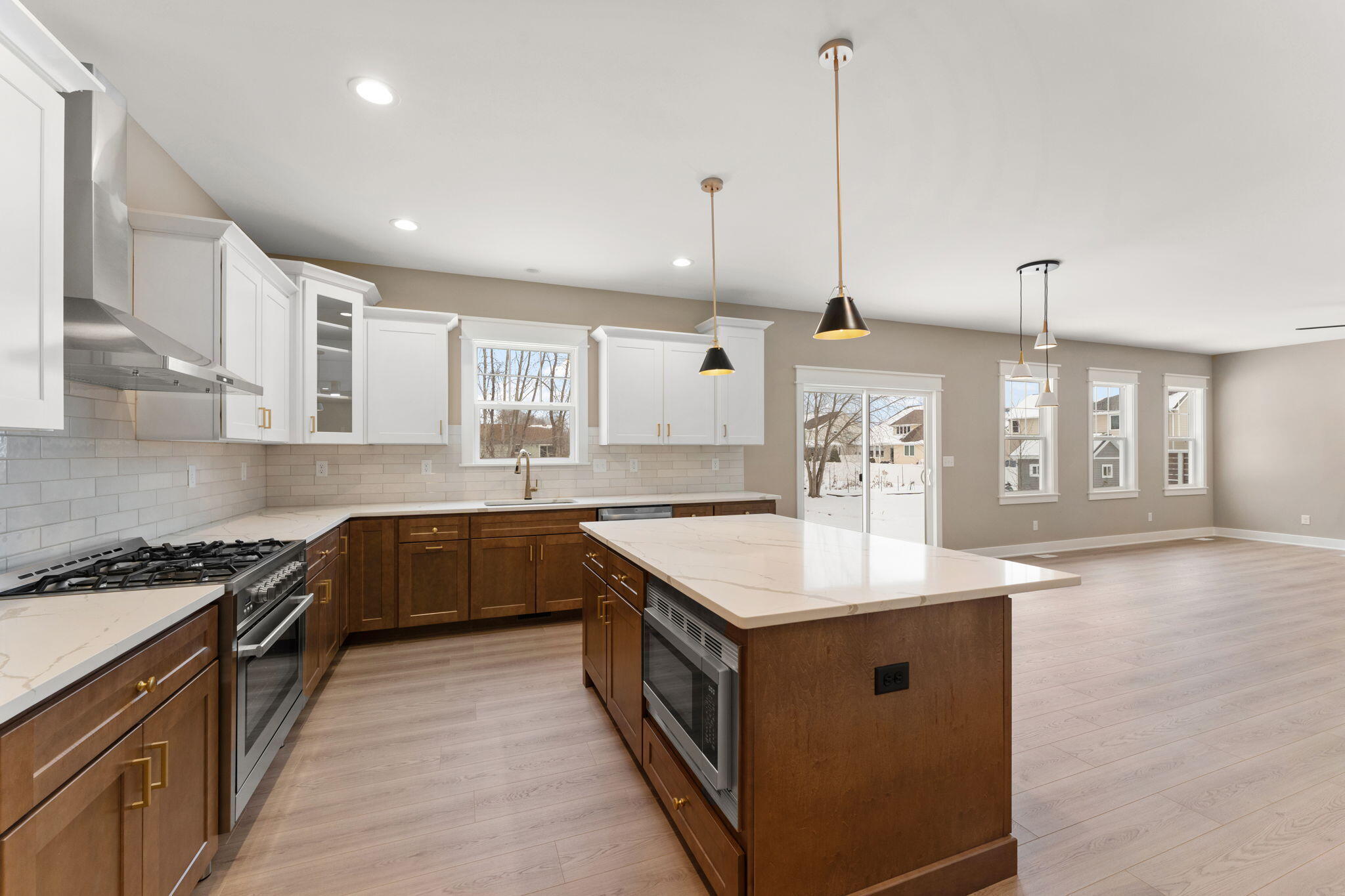 2132 Pradera Trail Chesterton, IN 46304 - Photo 24 of 46 a kitchen with a sink stove and cabinets