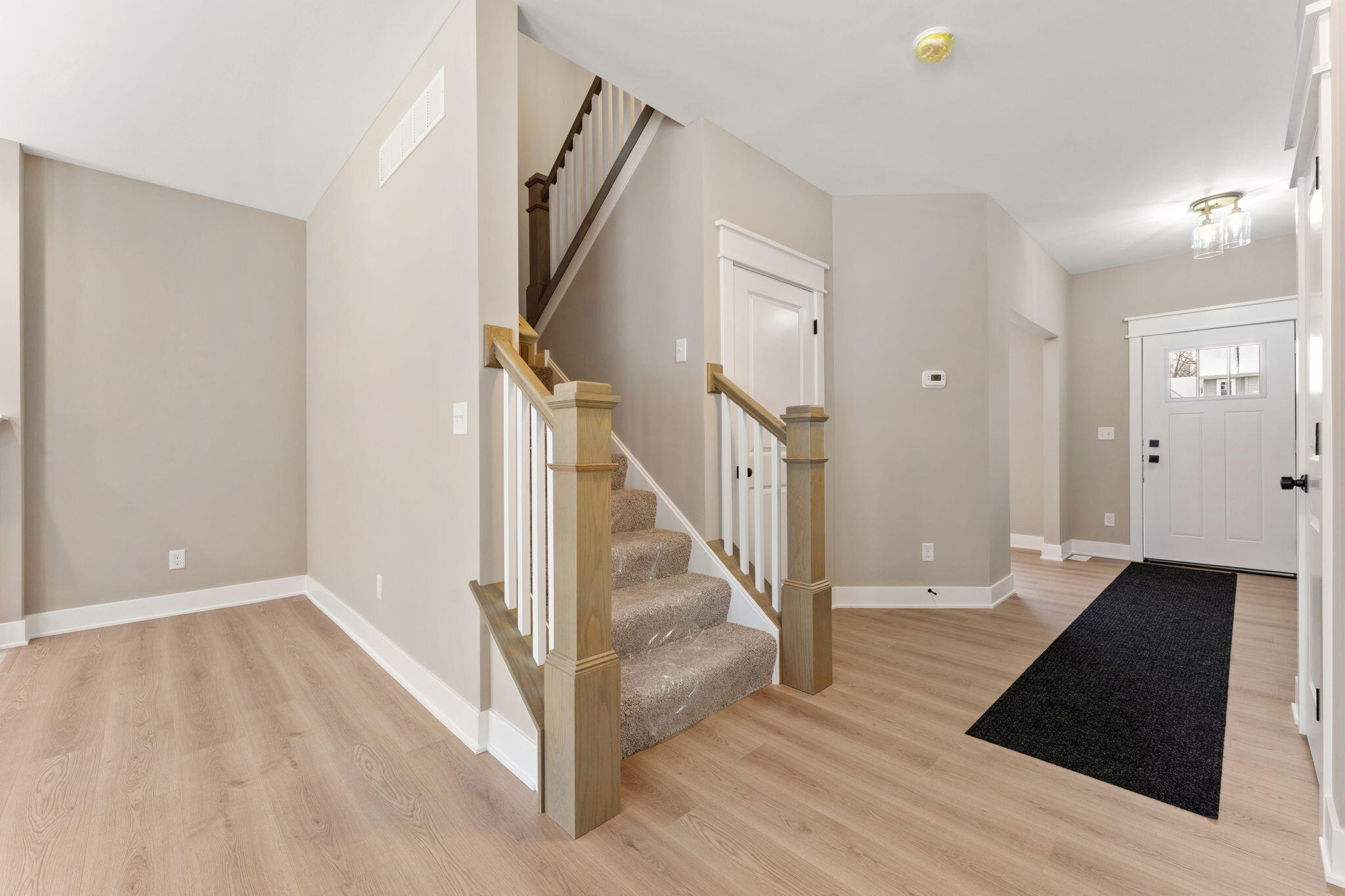 2132 Pradera Trail Chesterton, IN 46304 - Photo 26 of 45 a view of an entryway with wooden floor and door