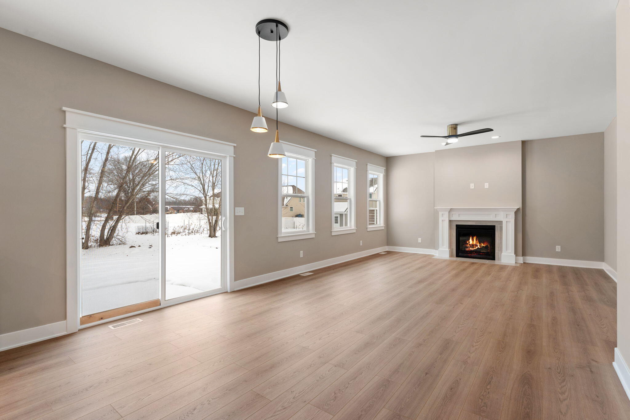 2132 Pradera Trail Chesterton, IN 46304 - Photo 26 of 46 a view of empty room with wooden floor and fireplace