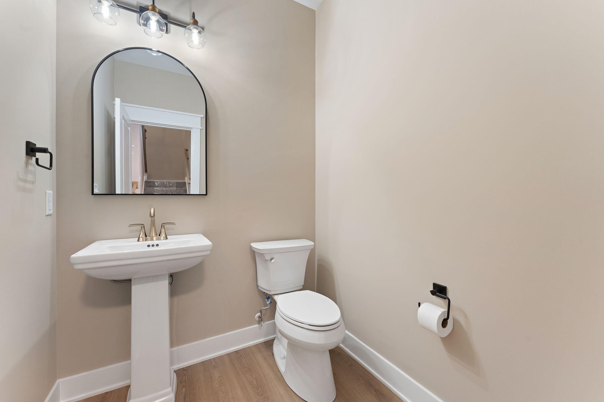 2132 Pradera Trail Chesterton, IN 46304 - Photo 9 of 46 a bathroom with a toilet a sink and mirror