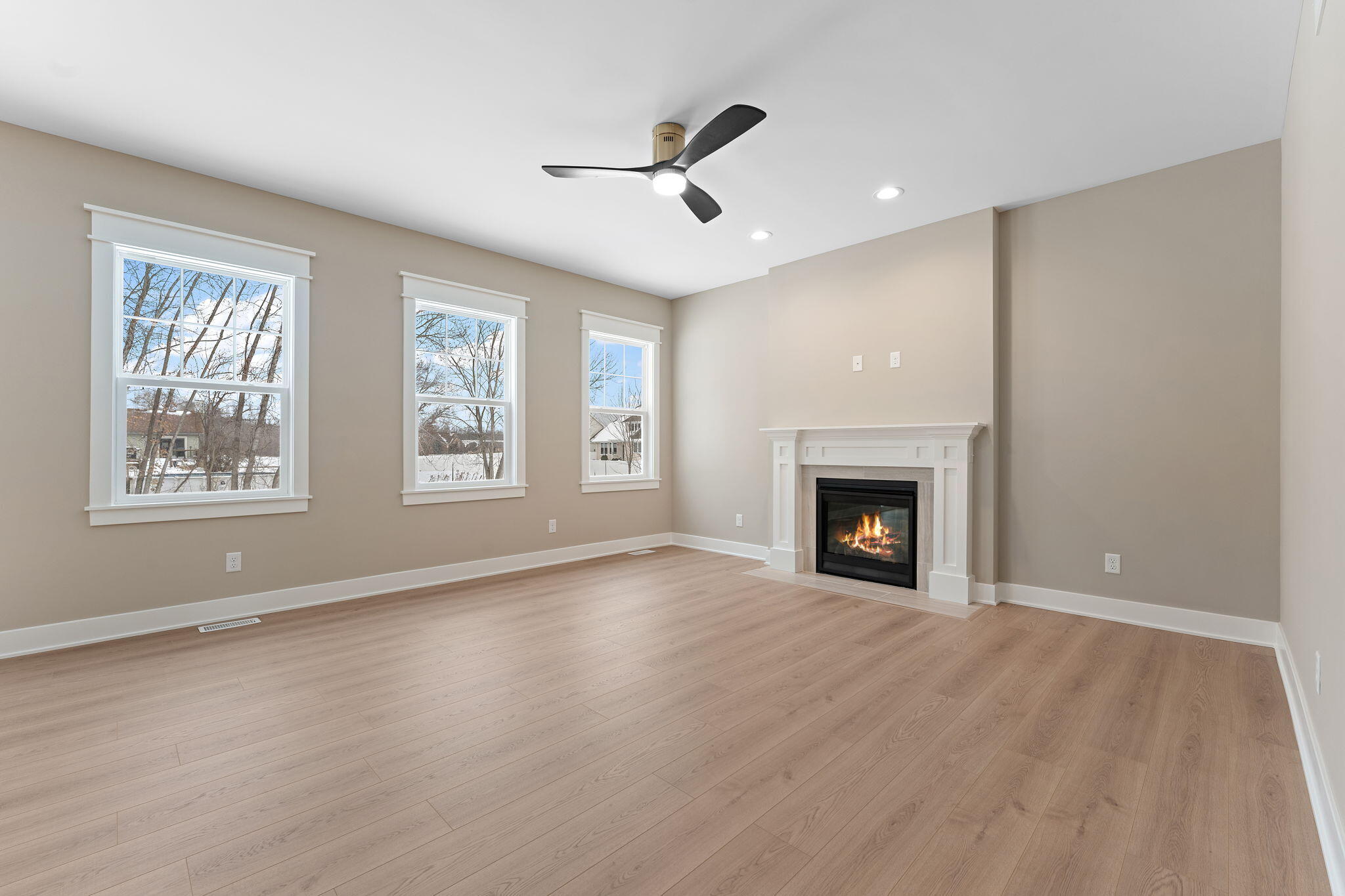 2132 Pradera Trail Chesterton, IN 46304 - Photo 9 of 45 a view of an empty room with a window and fireplace